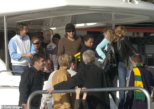 Connor is pictured with Keith Urban before his wedding to Nicole Kidman on a boat in Sydney Harbor in 2006.