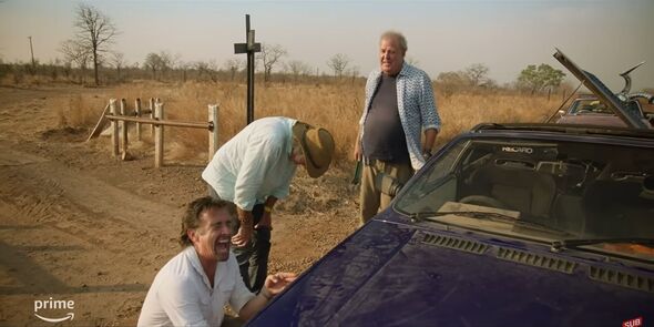 Clarkson, Hammond and May laugh while fixing the car